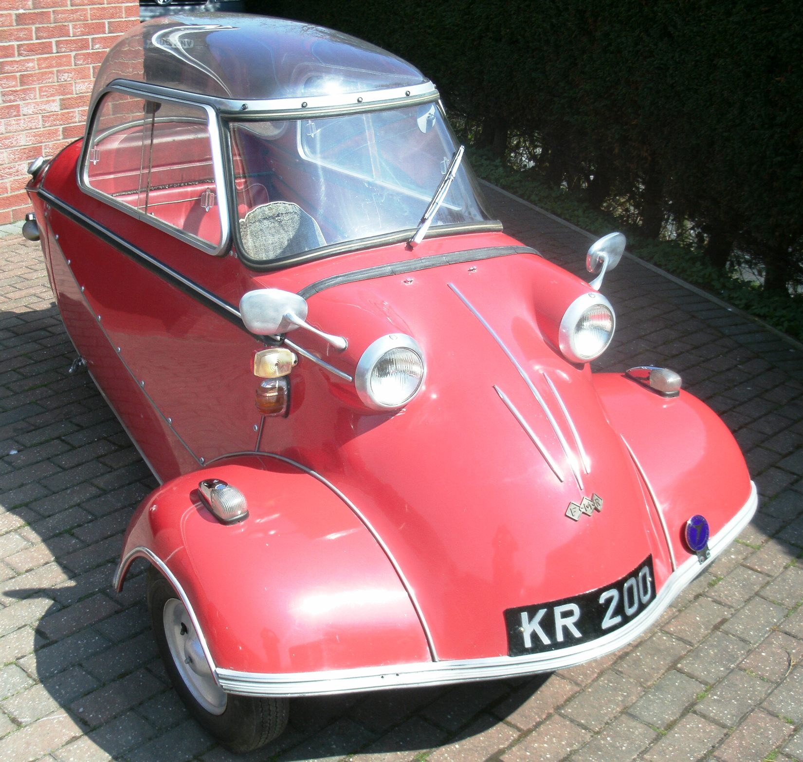 The Foundation's 1959 Messerschmitt KR200, a red example with its bubble canopy closed
